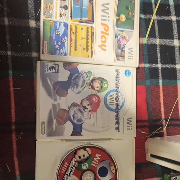 Wii with 5 games and 2 controls plus the controller wheel accessory